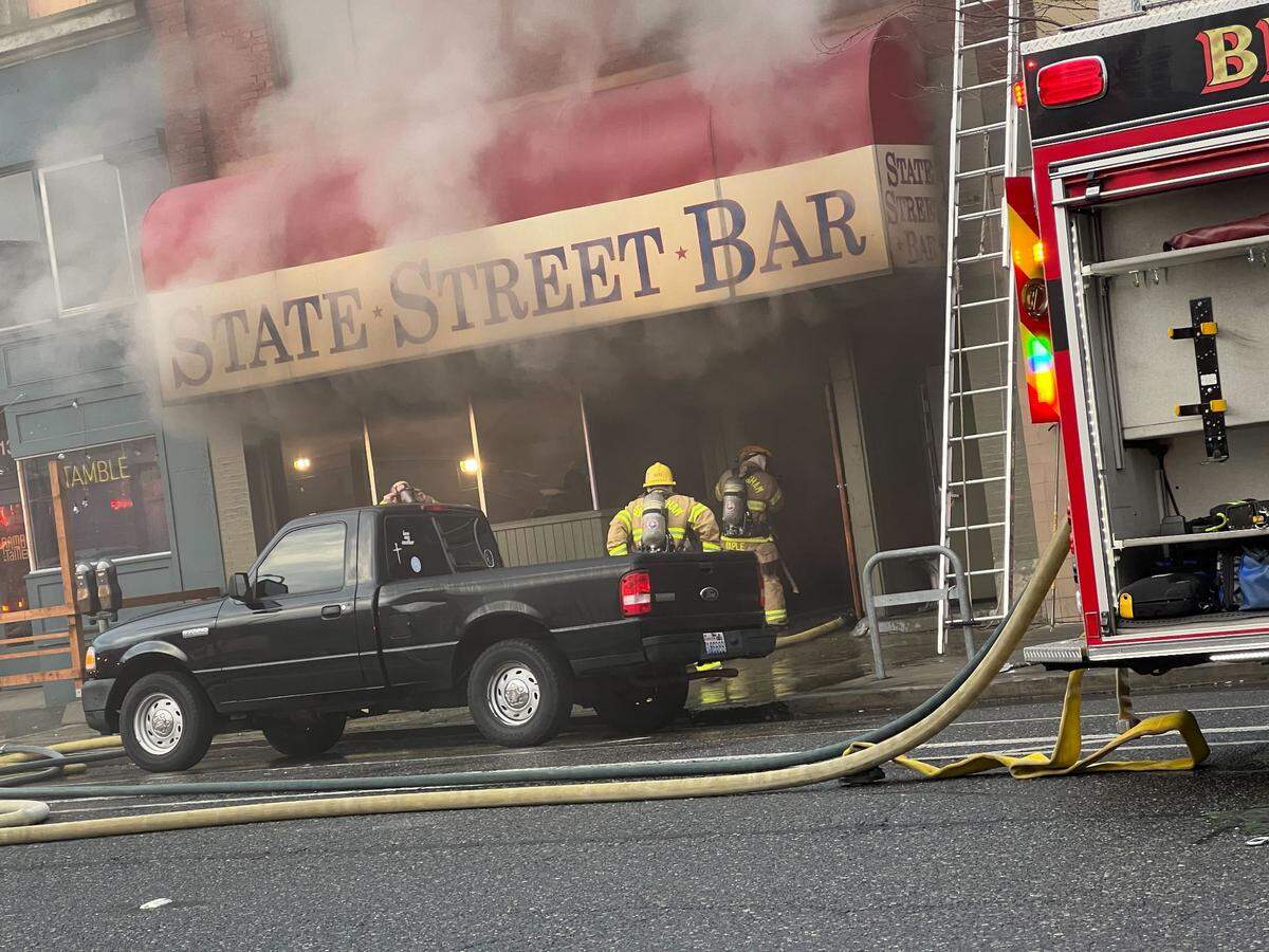 Fire crews battle flames at the State Street Bar Wednesday, Jan. 3 in Bellingham.