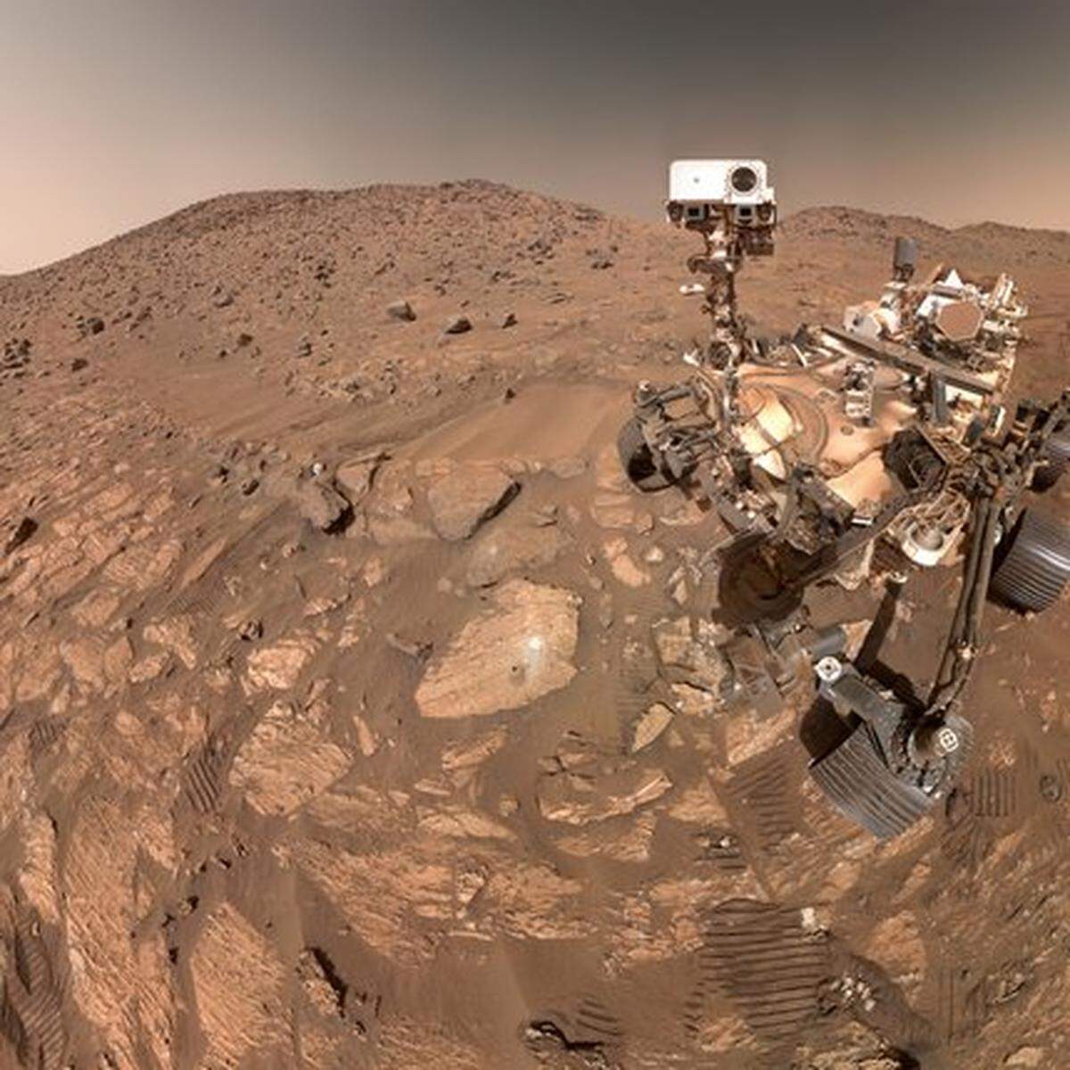 NASA’s Perseverance Mars rover took this selfie on July 23, 2024. To the left of the rover near the center of the image is the arrowhead-shaped rock nicknamed “Cheyava Falls,” which has features that may bear on the question of whether Mars was home to microscopic life in the distant past.