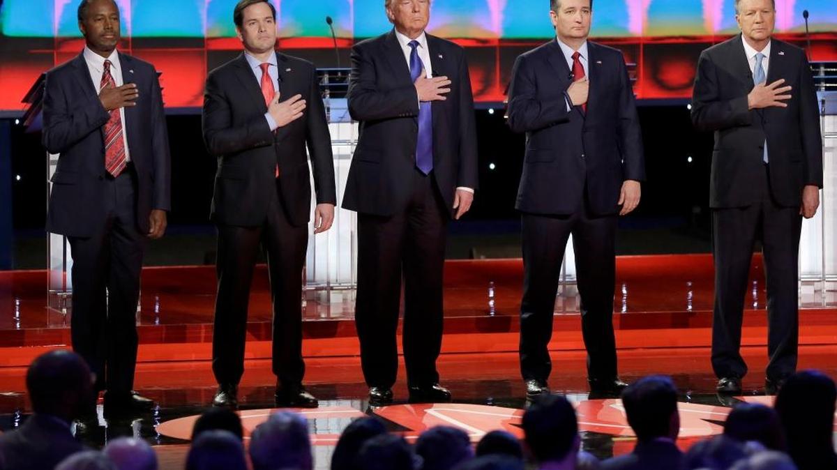 Republican presidential candidates, retired neurosurgeon Ben Carson, left, Sen. Marco Rubio, R-Fla., businessman Donald Trump, Sen. Ted Cruz, R-Texas, and Ohio Gov. John Kasich listen to the U.S. national anthem before a Republican presidential primary debate at The University of Houston, Feb. 25, 2016, in Houston. The GOP nominee will need 1,237 delegates at the Republican convention.
