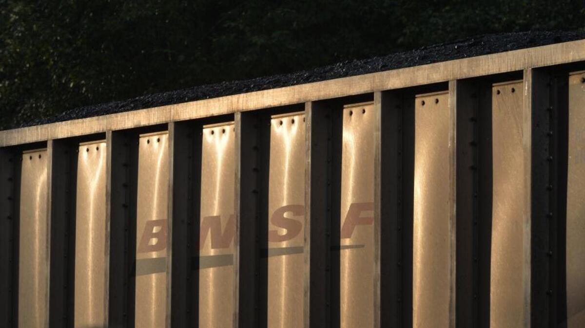 A coal train waits south of Blaine, Friday morning, Oct. 11, 2013, to cross the border and unload in Canada.