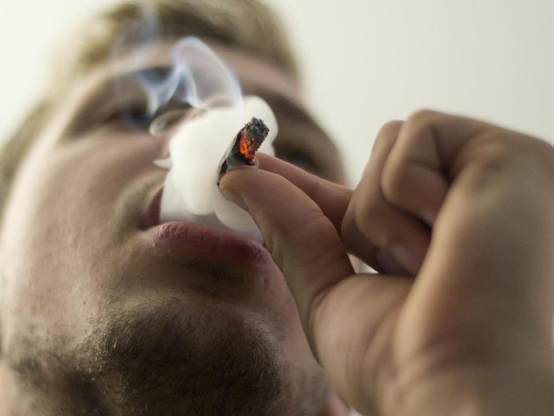 Dustin Hughes smokes cannabis on Dec. 18, 2013 in Bellingham, Washington. 