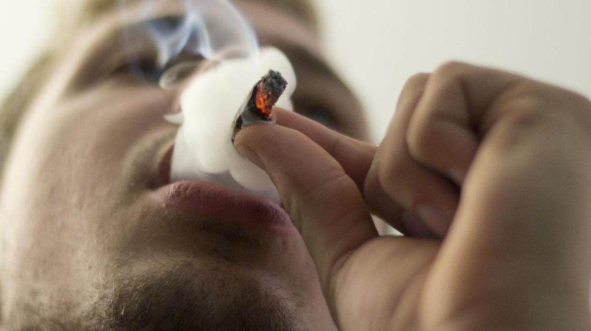 Dustin Hughes smokes marijuana on Dec. 18, 2013 in Bellingham, Washington. A new Washington State University study suggests regular cannabis users stay more relaxed in stressful situations – even when they are not under the influence.
