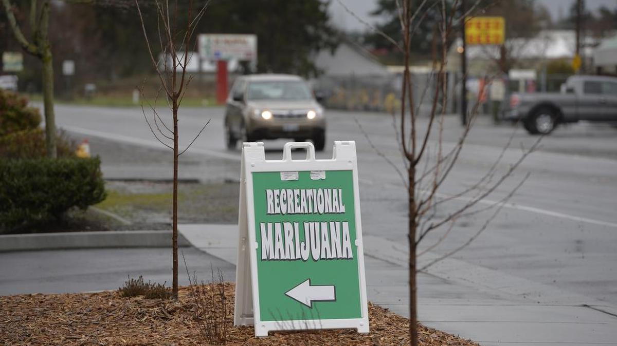A sandwich board advertises recreational marijuana for sale at Buds SOS on Portal Way in Ferndale Friday, Dec. 4, 2015. The Ferndale City Council on Monday, Dec. 7, 2015, approved a six-month moratorium on new pot stores so it can align its rules with new state regulations on marijuana.