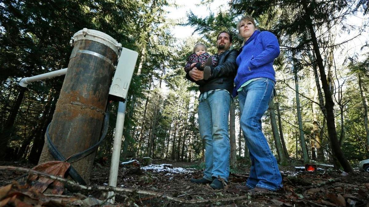 Bud and Deborah Breakey, with daughter Kaylin, paid to drill on property they own near Bellingham, where they hope to build a house. Several bills currently being proposed by lawmakers are taking aim at a recent Washington Supreme Court decision that put the onus on counties to determine whether water is legally available in certain rural areas before they issue building permits.