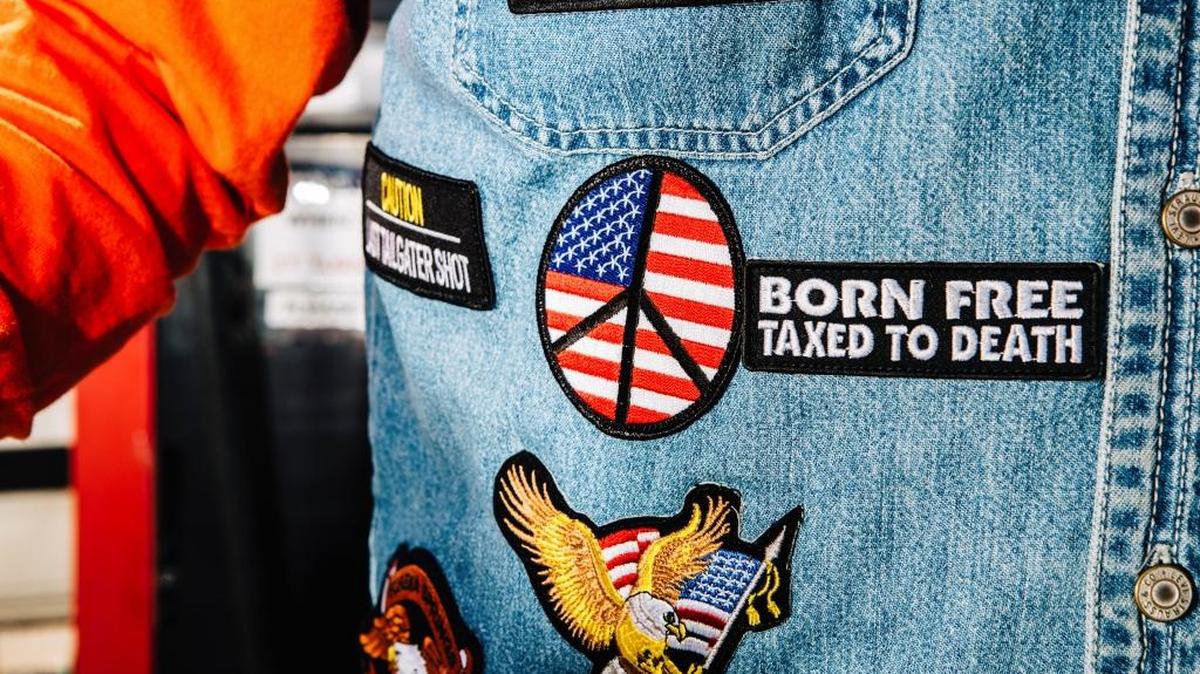 Patches on the jacket of Rick Frank, of Denver, Colo., while on a motorcycle ride with his wife Barbara, in Pine, Colo., July 1, 2017. Reporters asked people at roadside restaurants, outlet stores and rest stops in Colorado, Georgia and New Hampshire how they are feeling about America on its birthday.