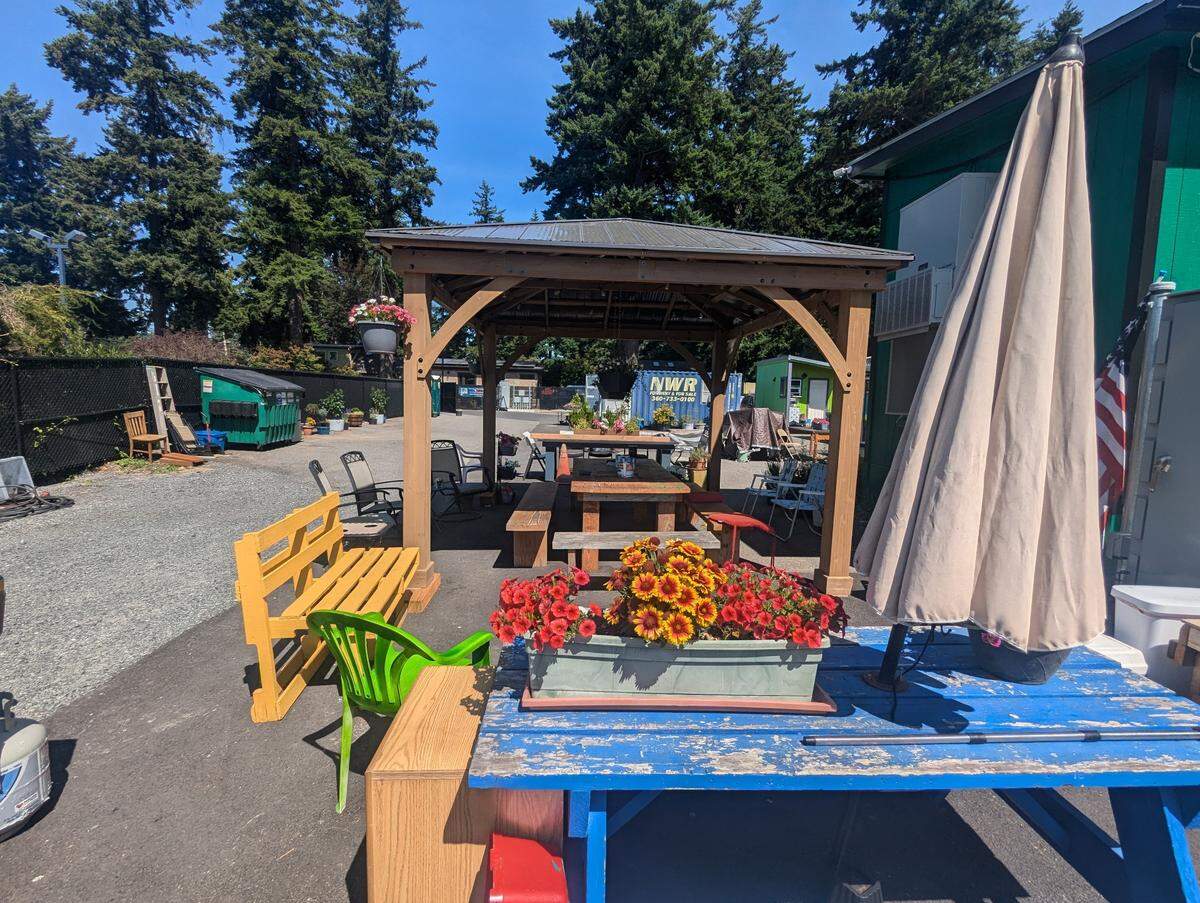 Communal area in North Haven. A barbecure and picnic tables are available to residents.