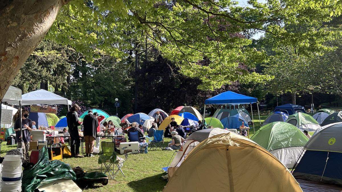 Protesters demanding that Western Washington University cut its ties with businesses and institutions that do business with Israel are shown at a protest encampment Wednesday, May 15, 2024, on the lawn in front of WWU’s Old Main administration building on the campus in Bellingham, Wash.