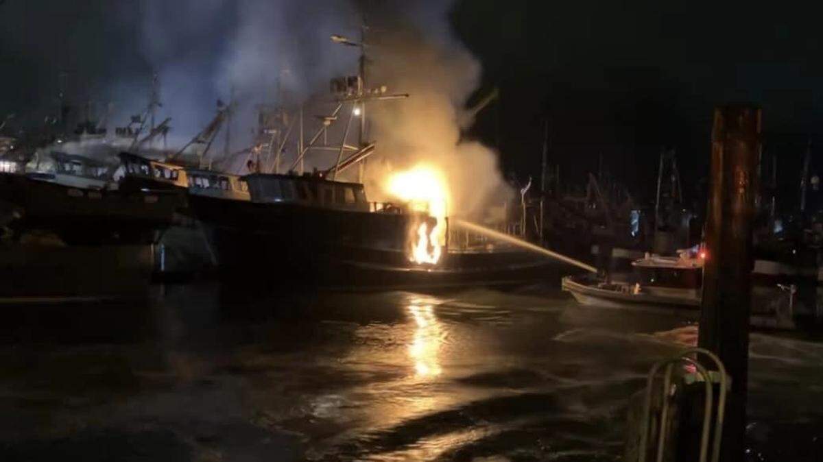 The fireboat Salish Star pours water on a 68-foot fishing boat ablaze in Squalicum Harbor about 1:45 a.m. Sunday, Oct. 27, 2024, in Bellingham, Wash.