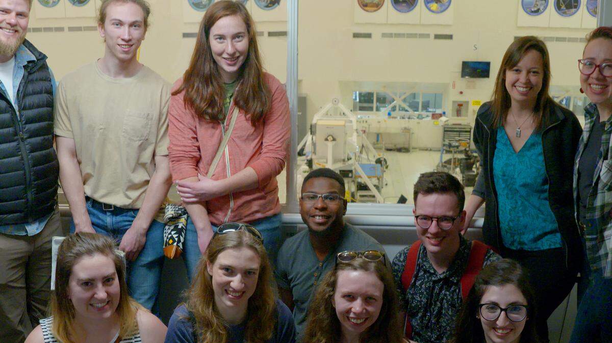 Western Washington University students and alumni working on the Curiosity and/or Perseverance rover missions gather at the viewing gallery of the Spacecraft Assembly Facility at NASA’s Jet Propulsion Laboratory in Pasadena, Calif. They are, from left, back row, Cory Hughes, Sam Condon, Isabella Seppi, Darian Dixon, Mason Starr, professor Melissa Rice, Jess Mollerup; front row, Kristiana Lapo, Katherine Winchell, Tina Seeger and Amanda Rudolph. Winchell holds a scale model of Mastcam-Z that will be used on the rover.