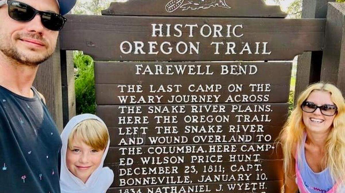 Jordan Welch, left, with his wife, Sara, and their son, Elias, at the Farewell Bend historical marker southeast of Baker City, Ore.