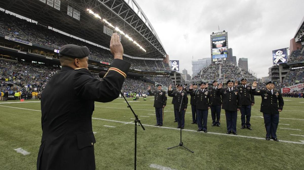 Washington National Guardsman are sworn-in during a re-enlistment ceremony on the field as part of the NFL’s Salute to Service tribute to the military before last November’s game between the Seahawks and the New York Giants in Seattle.