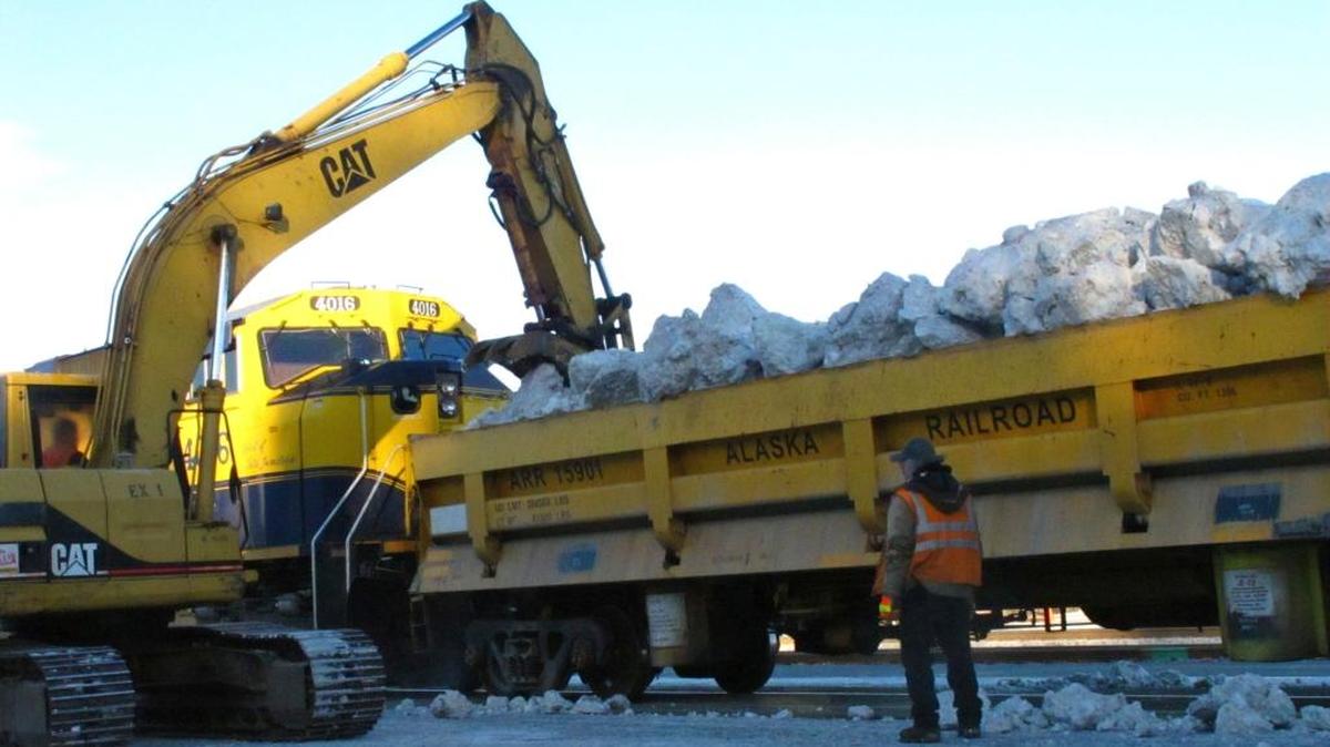 Workers offload an Alaska Railroad train that delivered tons of snow to Anchorage, Alaska, on March 3, 2016, after traveling 360 miles south from Fairbanks. The snow will be used to help provide a picturesque ground cover on the streets for the ceremonial start of the 1,000-mile Iditarod Trail Sled Dog Race in Anchorage, where persistent above-freezing temperatures have melted much of the local snow. The competitive part of the race kicks off Sunday 50 miles to the north in Willow.