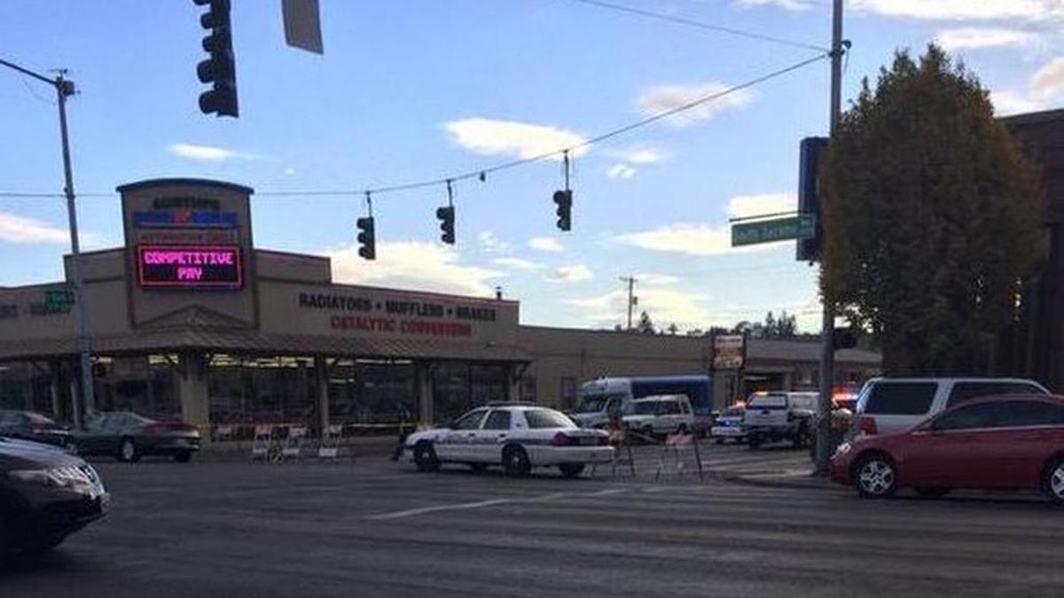 
Police block off streets near the scene of a shooting involving an off-duty Tacoma police officer Wednesday.
