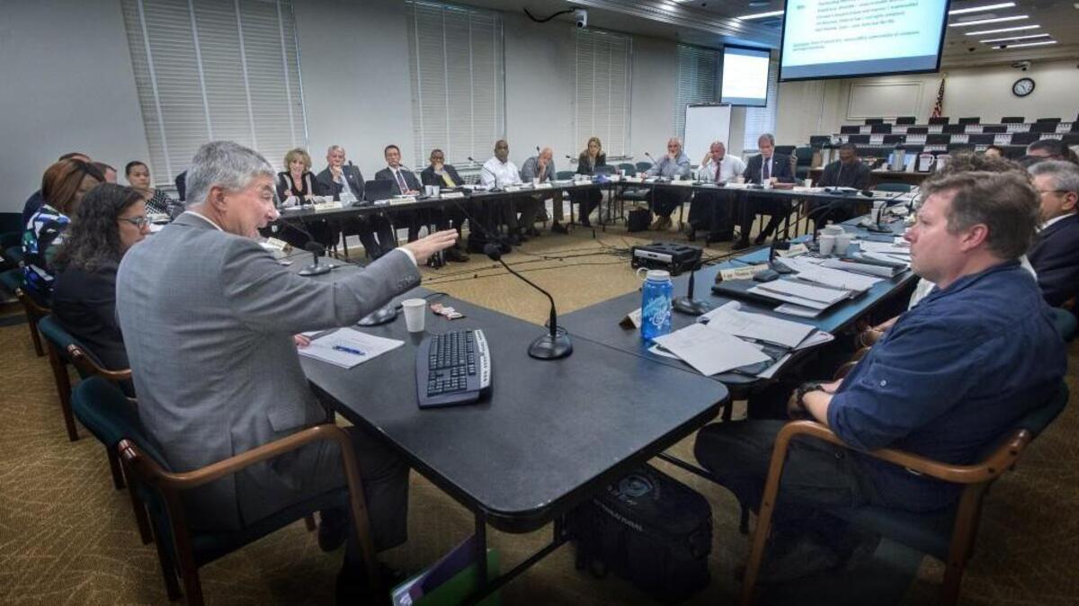 Tom McBride, executive secretary for the Washington Association of Prosecuting Attorneys, explains the police officer use of force rules during a joint legislative task force on Washington’s police use of deadly force laws in the John O’Brien Building at Olympia on Tuesday.