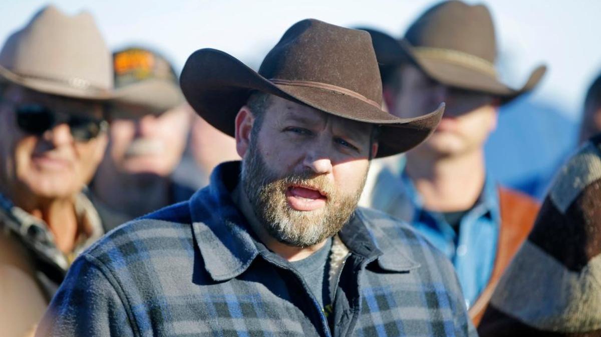 Ammon Bundy speaks with reporter at a news conference at Malheur National Wildlife Refuge Friday, Jan. 8, 2016, near Burns, Ore. Bundy, the leader of an armed group occupying the national wildlife refuge to protest federal land management policies said Friday he and his followers are not ready to leave even though the sheriff and many locals say the group has overstayed their welcome.