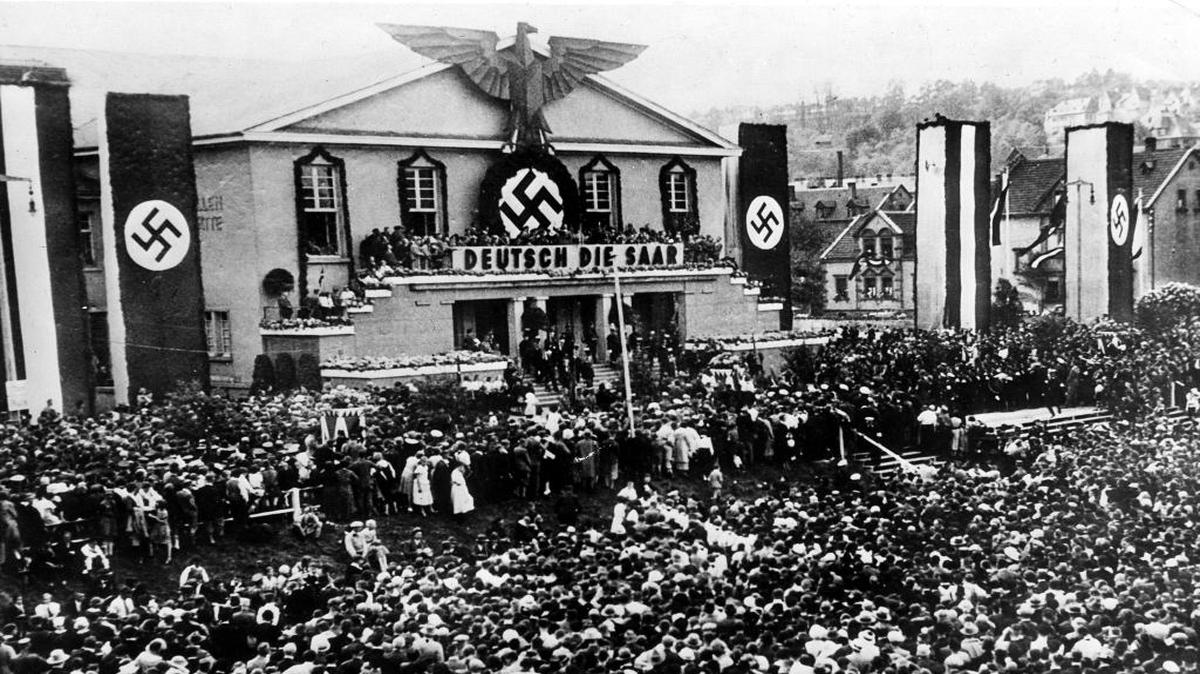 A view of the 100,000 Germans, many of them residents of Saar, listen as Dr. Paul Joseph Goebbels, minister of propaganda, declares: "There can be no compromise on the Saar question; come what may, the Reich will stick to you," during a rally at Zweibruecken, Germany, May 14, 1934.