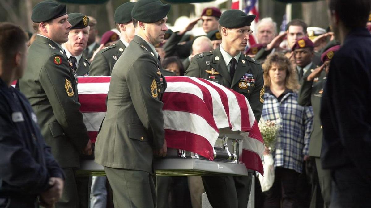 The casket of Sgt. 1st Class Nathan Ross Chapman is carried to the grave site during Friday’s military funeral service Jan. 11, 2002, at Tahoma National Cemetery in Kent.