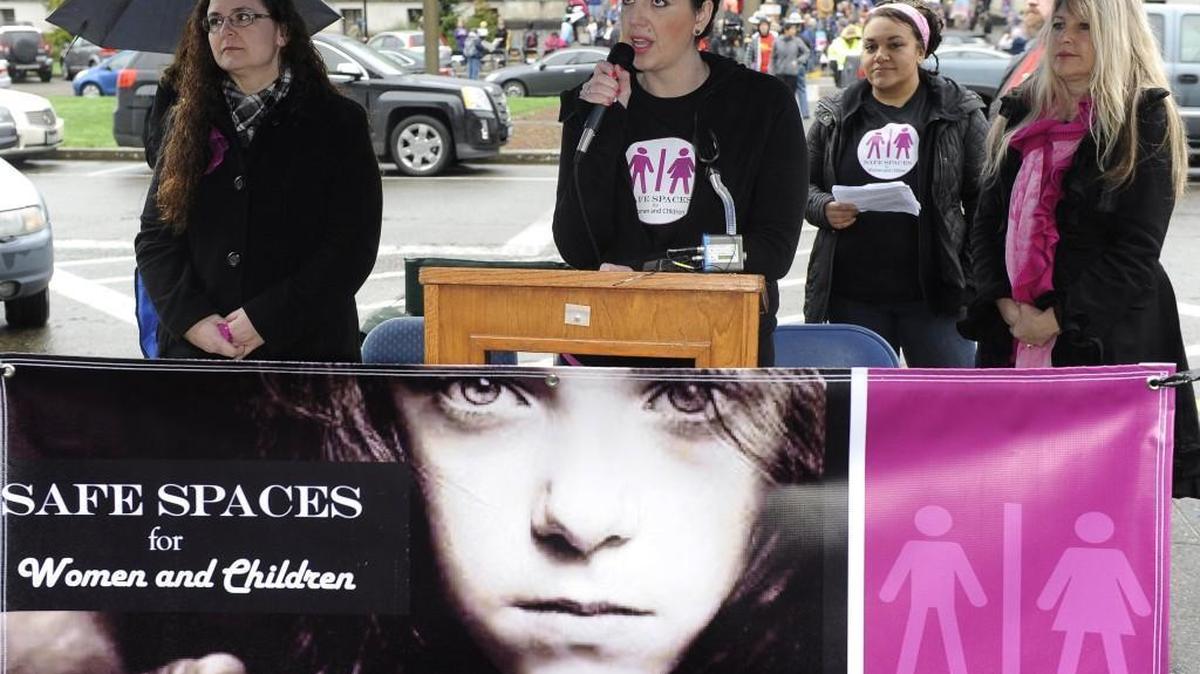 Starting off their Safe Spaces for Women and Children rally Monday on the Capitol steps, Kaeley Triller Haver from the “Keep Locker Rooms Safe” organization speaks. At the same time, a group that supports the new state rule allowing transgender people access to restrooms and locker rooms of their gender identity stages a counter protest behind them at the Temple of Justice.