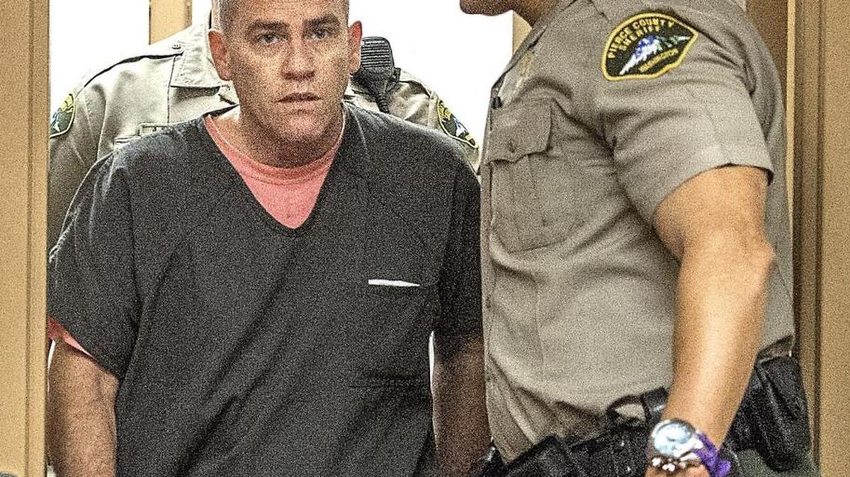 Tracy Worwood of Tacoma is led into court Thursday during his arraignment on charges of unlawful possession of an explosive device and reckless endangerment. Worwood was released on his own recognizance.