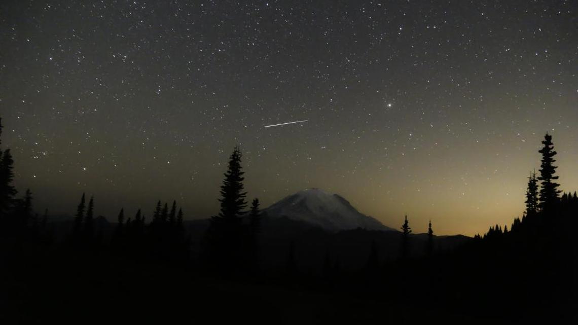 A meteor from the Perseid Meteor Shower over Mount Rainier, as photographed in August 2015 from the Naches Loop Trail at Mount Rainier National Park. A fireball, suspected to be a meteor, was visible across most of Western Washington Saturday night.