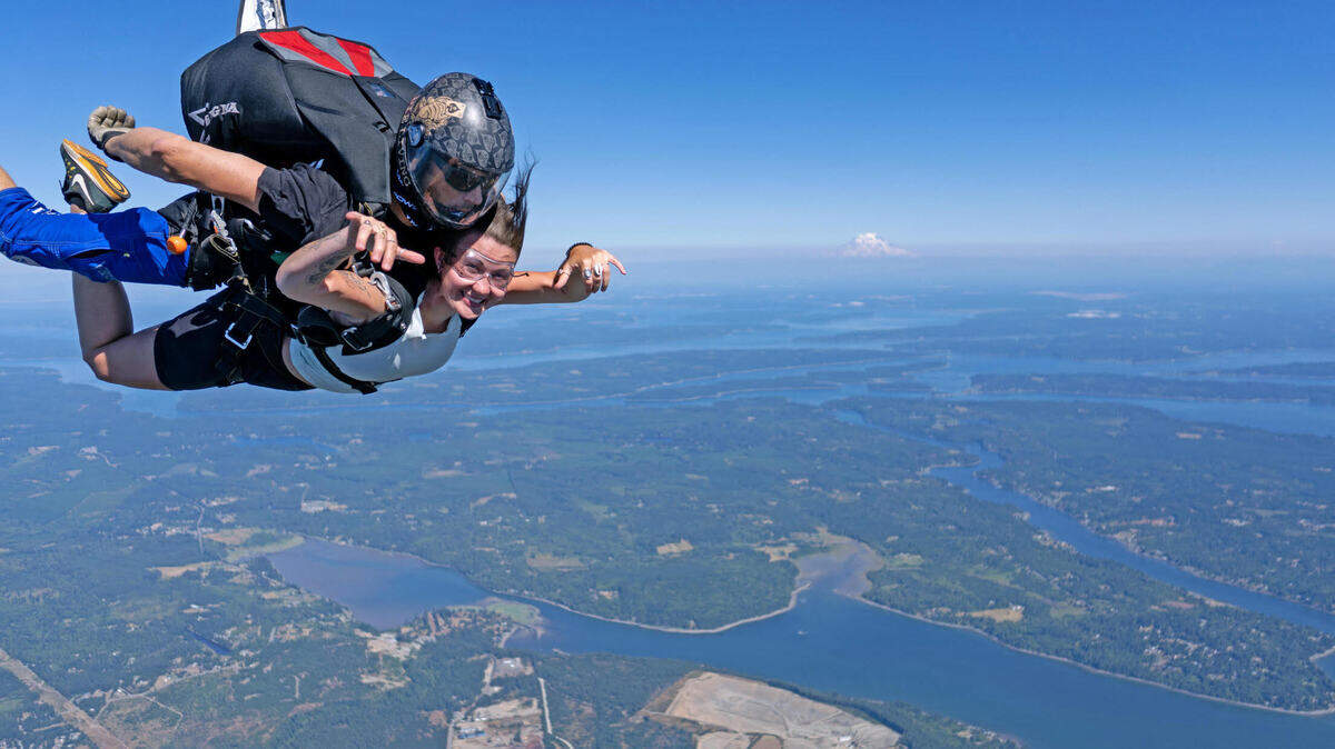 Caption: Tandem skydive at Skydive Kapowsin with Washington’s Mount Rainier in the background. 