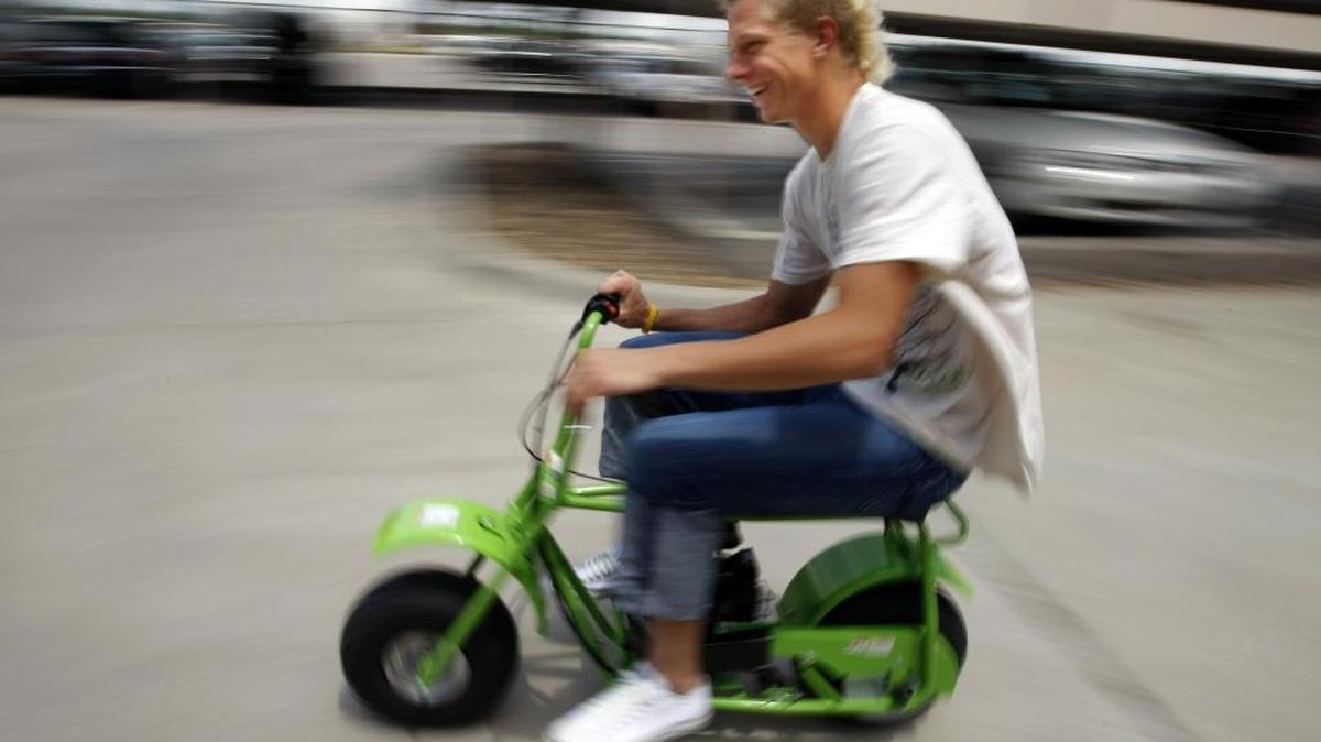 FC Dallas teenage soccer pro Brek Shea rides his gas powered mini-bike outside his apartment across from Pizza Hut Park in Frisco, Texas. Motorized vehicles are not allowed in bike lanes in Washington, and there are other laws for mopeds and motor-driven cycles.