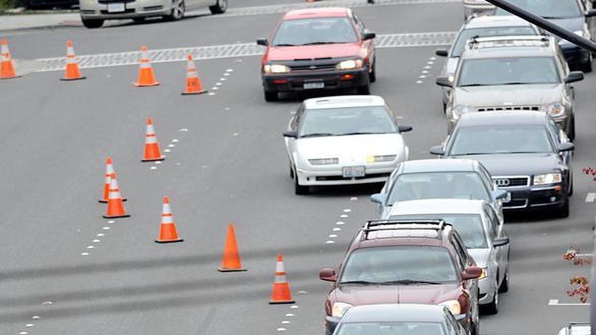 Traffic merges at East Holly and North Forest streets for construction in Bellingham in 2009. Most states encourage drivers to utilize the “zipper merge” and wait until reaching the cones to merge.