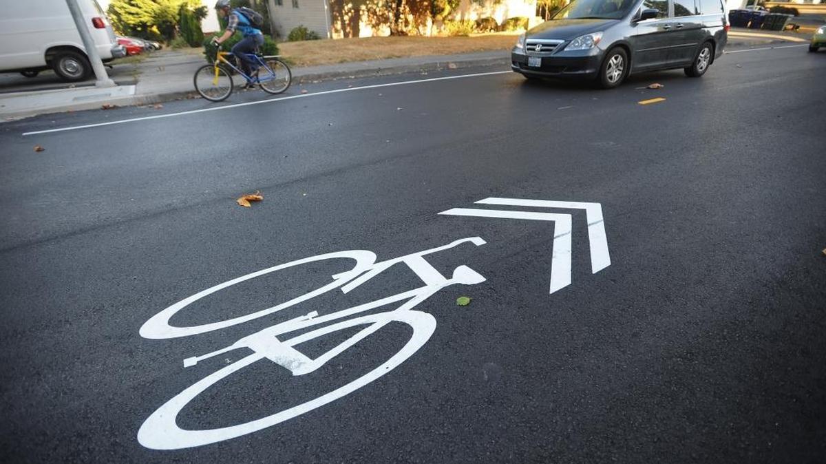 Pavement markings called “sharrows” alert drivers that they are sharing a narrow road with bikes on Indian Street north of the Western Washington University campus.
