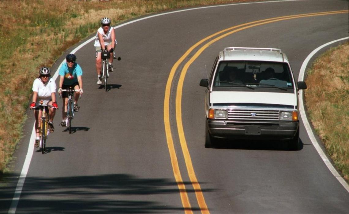 The Revised Code of Washington states drivers may not drive on the left side of the roadway within a no-passing zone, even to pass cyclists.