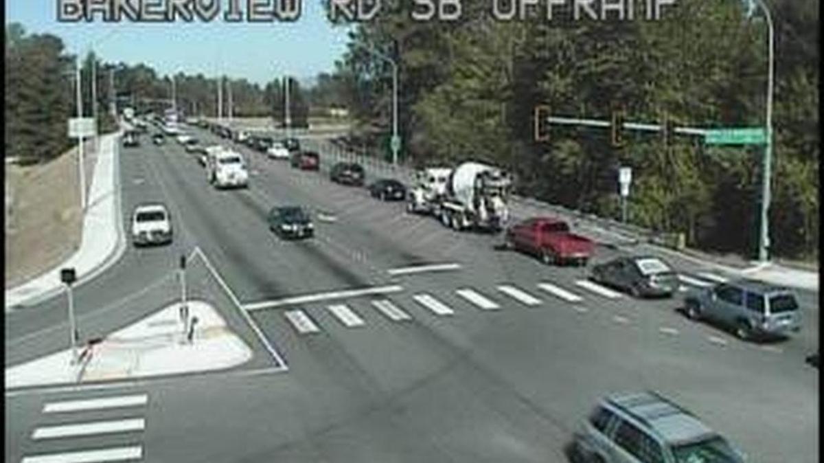 
Cars line up on the West Bakerview Road overpass of Interstate 5. Eastbound cars turning onto the freeway on-ramp must yield to westbound cars making the same turn onto the ramp. 

