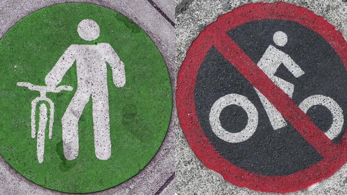 Despite the confusion of two different sets of markings, municipal code in Bellingham prohibits riding a bicycle on the sidewalks in downtown.