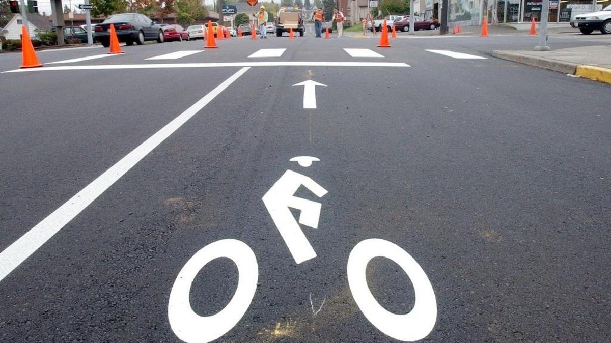 
Bike lanes on East Magnolia Street at North Forest Street in Bellingham point bicyclists to which direction they should travel. Bikes in the lanes must ride in the same direction as vehicle traffic.

