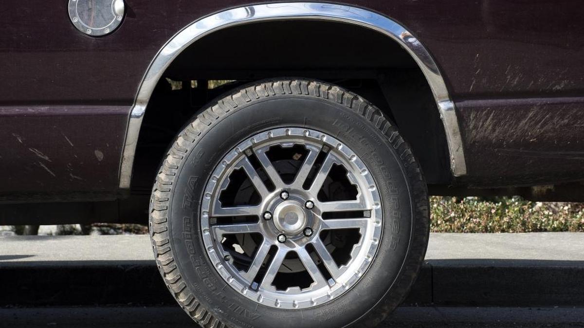 A pickup truck sits parked along Cornwall Avenue on Tuesday, March 15, in Bellingham. Tires can’t extend farther than the truck fender in Washington state.