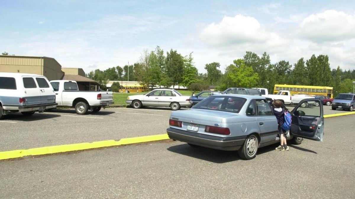 The Roosevelt Elementary School parking lot, from a 2001 file photo. Police can enforce some traffic violations in parking lots.