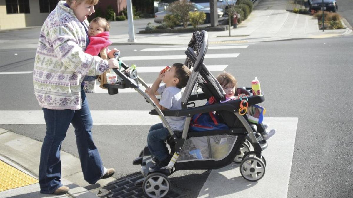 Nanny Diane Kitchen crosses East Maple Street in Bellingham with the kids she is watching on Feb. 24, 2016. For safety’s sake, drivers should stop for pedestrians as soon as it appears the pedestrian is about to enter a crosswalk.