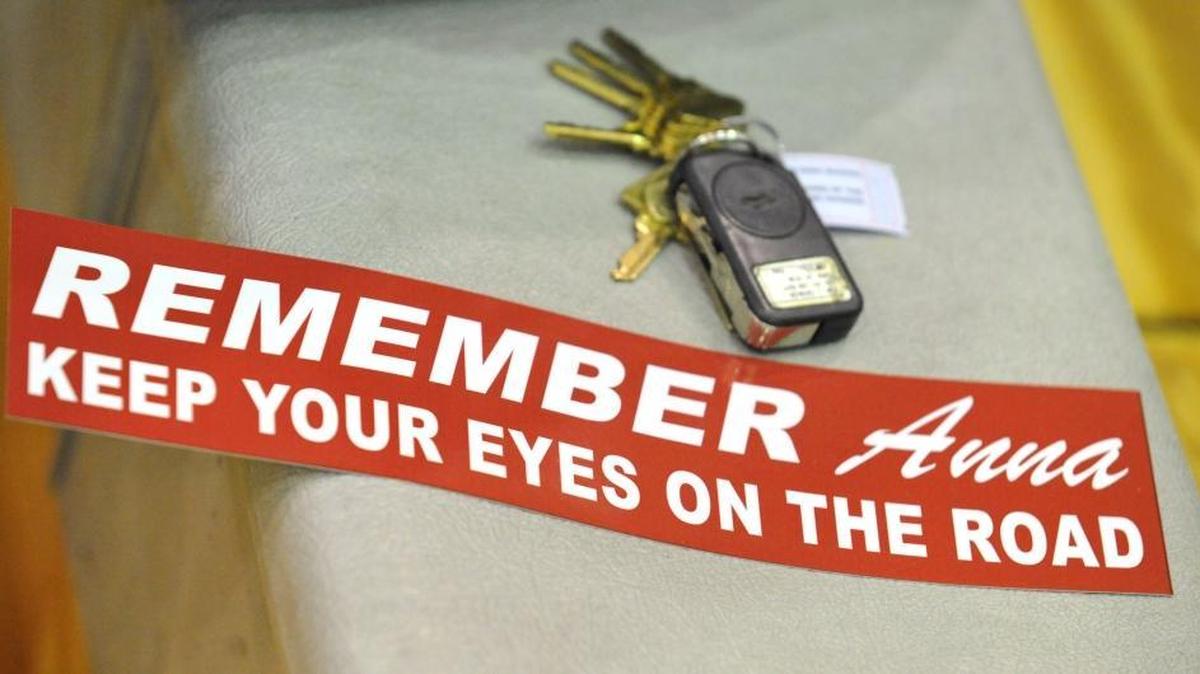 Cars keys rest next to a bumper sticker handed out to spectators at Bellingham High School during a charity basketball game to raise money for the Anna Brulotte Memorial Fund on Nov. 9, 2010. Anna, 2, was killed Sept. 30, 2010, when she was struck by a car while crossing Virginia Street with her mother and two siblings. The driver was distracted and not looking at the road.