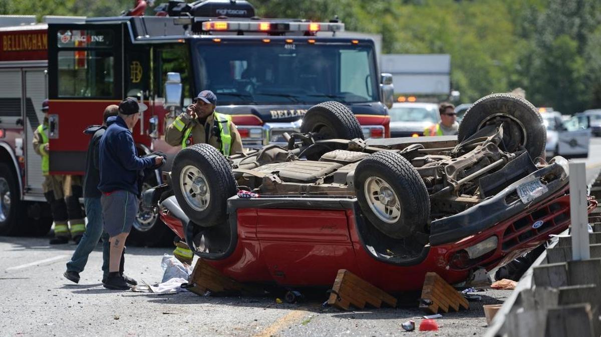 Bellingham Fire and Washington State Patrol investigate the scene of a rollover accident on I-5 northbound north of the Fairhaven exit in Bellingham, July 10. There were only minor injuries reported at the scene. Over the past 10 years, Whatcom County has averaged about 15 lives lost due to traffic crashes, but already there have been 20 fatalities in 2017.