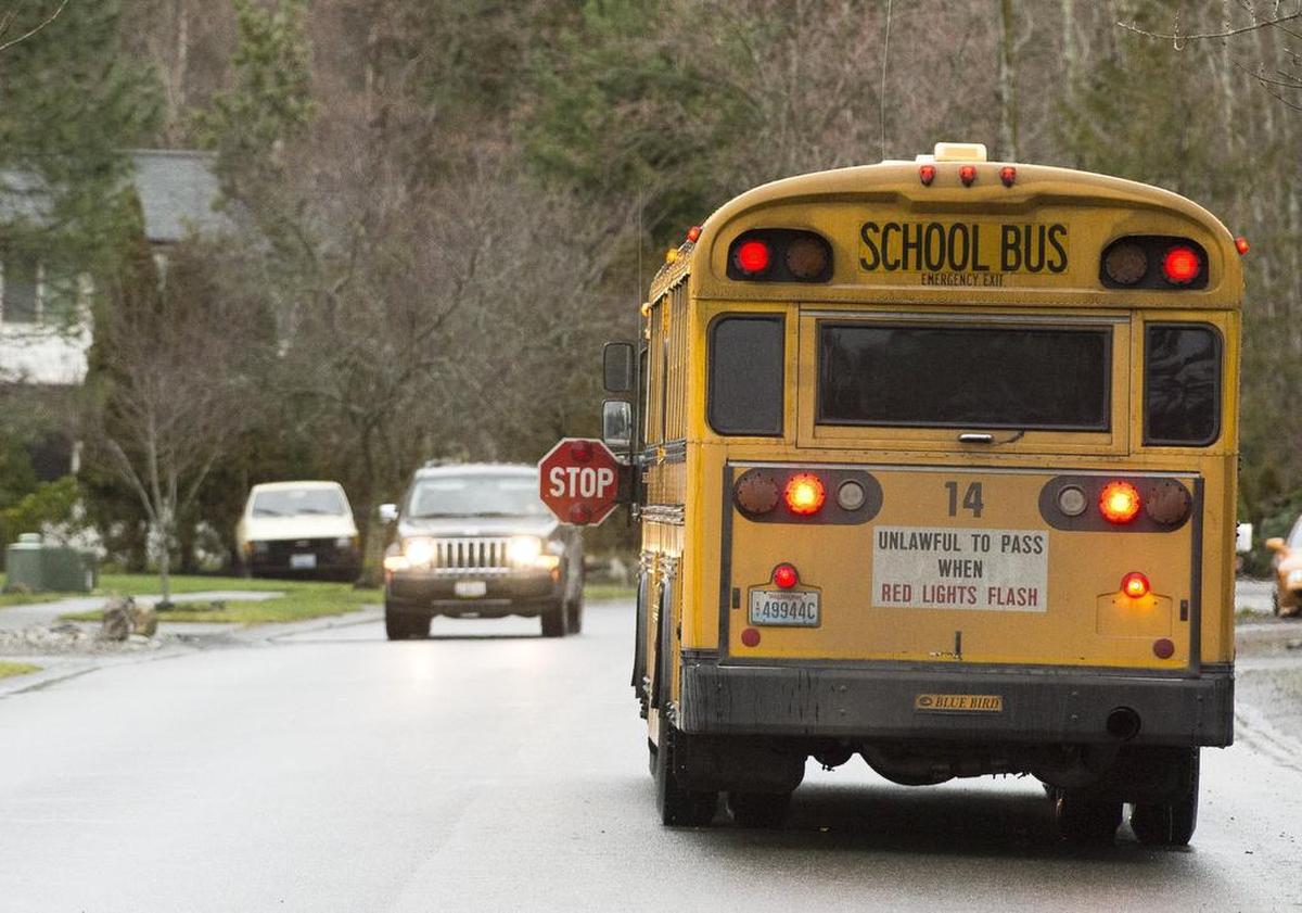A car slows down as it approaches a stopped school bus near the intersection of Brownsville Drive and Hillsdale Road in Bellingham. School bus drivers see good and bad driving kids to and from school, and they have advice on how to make the roads safer for students as classes are about to start in Whatcom County.