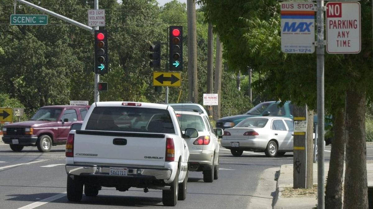 Cutting through a gas station to avoid a traffic signal isn’t illegal under Washington law, but some cities ban it..