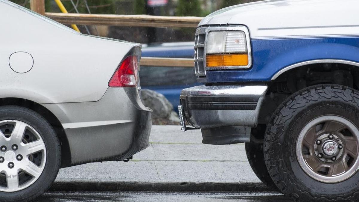 Two vehicles parallel parked close together on Chestnut Street are pictured Wednesday, March 9, in Bellingham. If you are parking and accidentally bump the car in front or behind you, the law says you must find the driver or leave a note, even if there doesn’t appear to be any damage.