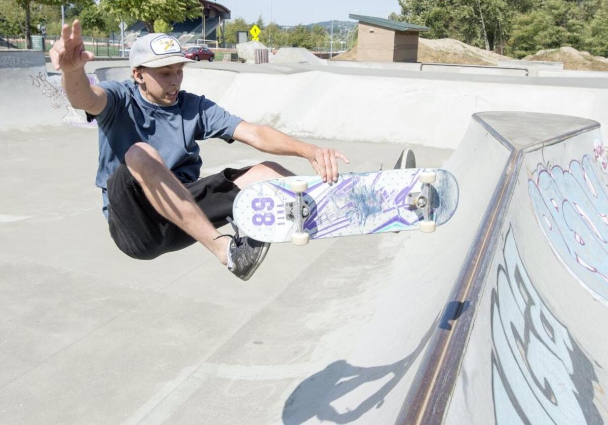 Tanner Hinrichs rides his skateboard at Bellingham Skate Park before heading to work on Aug. 27, 2015. Skateboarders are treated like pedestrians on roads in Washington state, but local jurisdictions, including the city of Bellingham, have their own restrictions.
