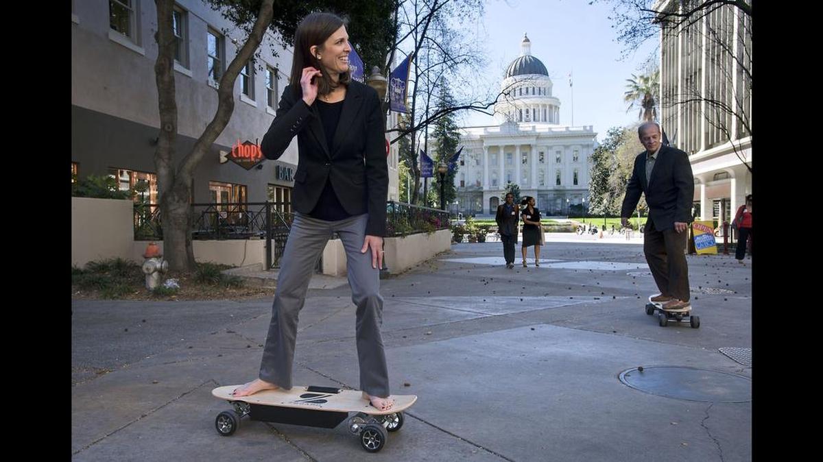 California state assembly member Kristin Olsen rides an electrically powered skateboard called a ‘Zboard’ during a press event near the State Capitol in Sacramento on in 2014. Assembly member Kristin Olsen discussed AB 2054, a bill that would permit the use of electrically-motorized skateboards as alternative modes of transportation. Washington state does not have laws relating to electric powered skateboards.