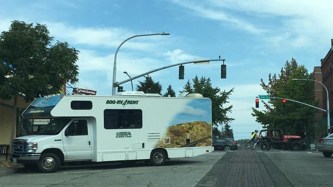 The rules for parking a vehicle that obstructs the flow of traffic in angled spaces vary according to municipality in Washington State. The city of Bellingham has a municipal code stating that no person shall park a vehicle in a parking spot so that any part of the vehicle extends beyond the markings of the parking spot, meaning this RV in Fairhaven is not parked legally.