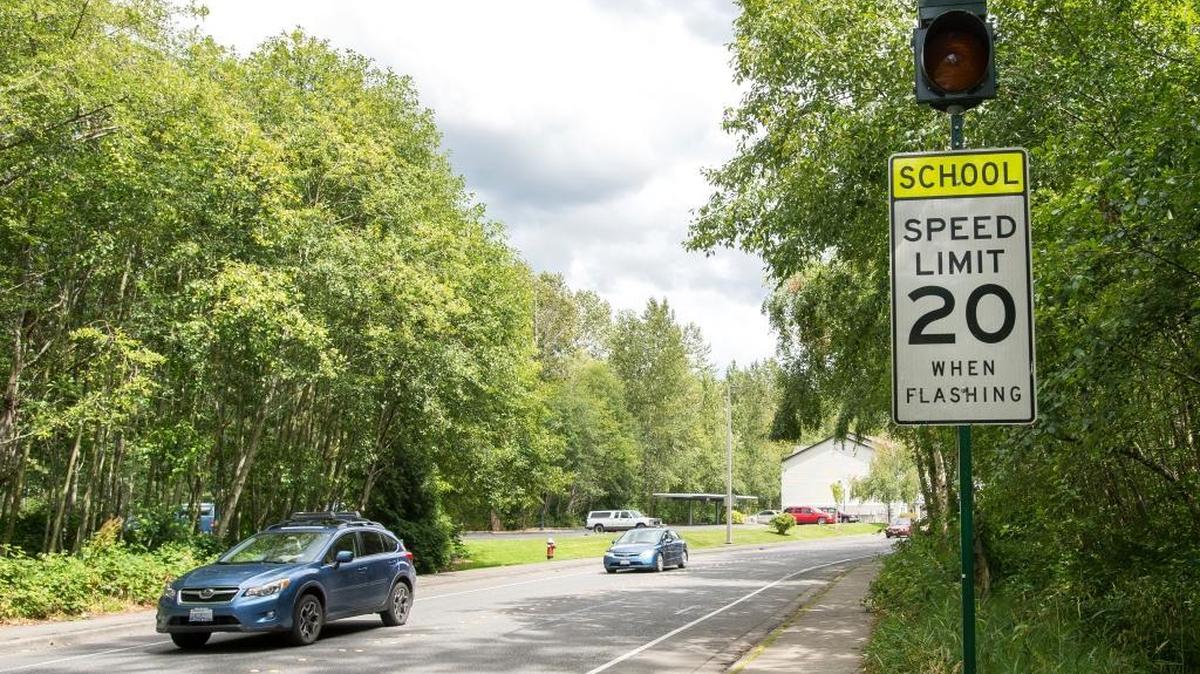Cars drive down Fraser Street through a school zone on Friday, July 8, in Bellingham.