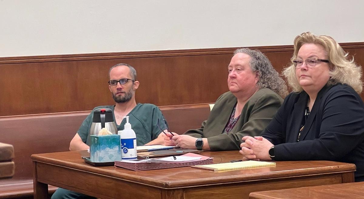 Jake Unick, left, wears jail-issued clothing in the courtroom with his lawyers, Kelli Armstrong-Smith, center, and Shauna Bean on Monday, Sept. 9, 2024, at the Whatcom County Courthouse in Bellingham. 