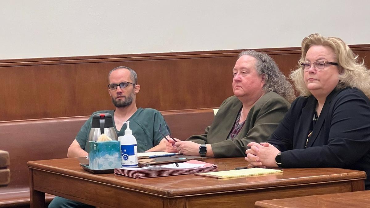 Jack Unick, left, wears jail-issue clothing in the courtroom with his lawyers, Kelli Armstrong-Smith, center, and Shauna Bean on Monday at the Whatcom County Courthouse in Bellingham.