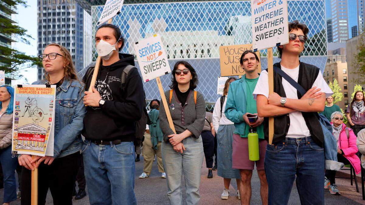 A few dozen protesters rally at the Nakamura Federal Courthouse on Monday, April 22 as the U.S. Supreme Court heard oral arguments in Grants Pass v. Johnson, a case that would make it easier for cities to fine or jail people experiencing homelessness for sleeping in public.