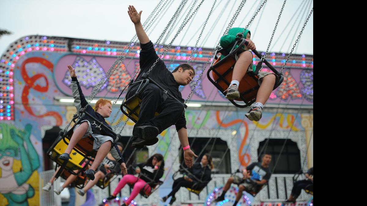 
Cousins Roman Meenk, 10, left, of Lynden and Elijah LaForge, 17, of Yelm enjoy the YoYo ride at the 2014 Northwest Washington Fair in Lynden.
