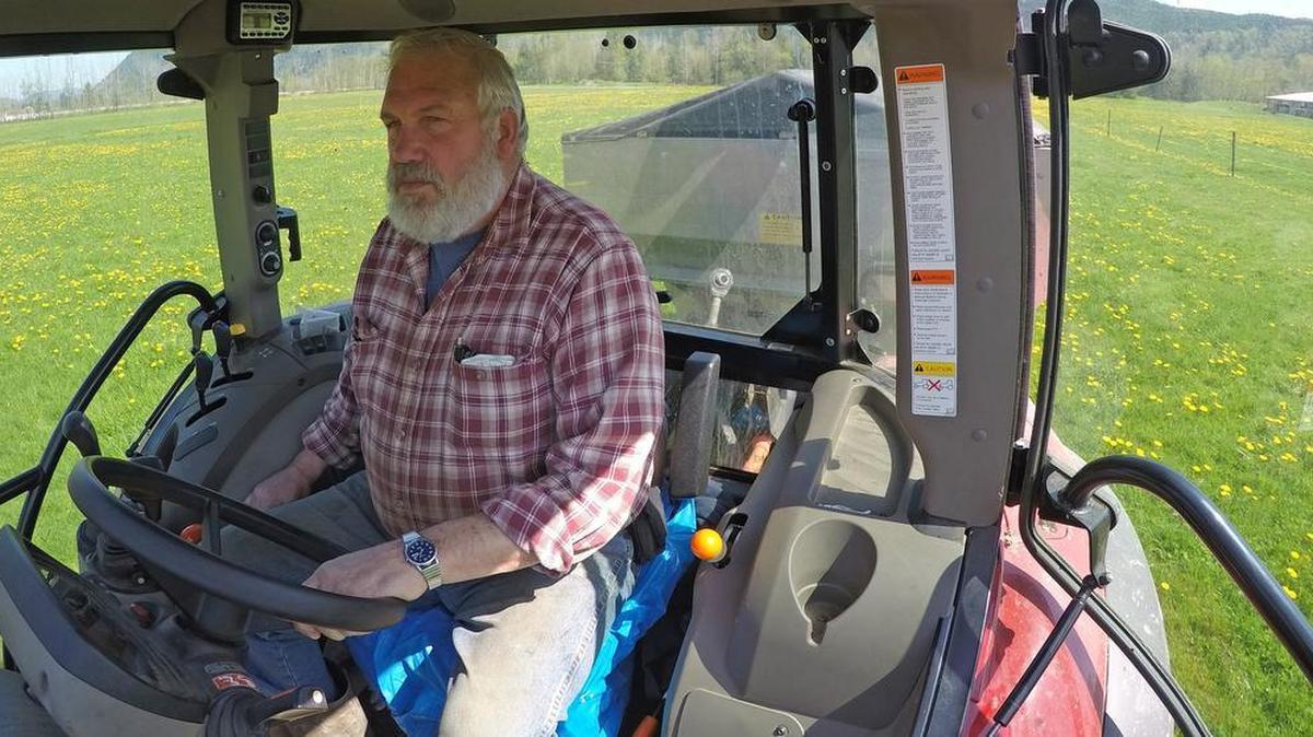 
Elvin Kalsbeek drives a tractor spreading fertilizer on one the fields he uses to grow silage and hay on near Acme in April, 2015. The state has expanded its drought declaration to include water basins in Whatcom County, including the Nooksack. Although he doesn't use water from the Nooksack river directly, the drought could affect the water levels of the wells he uses to irrigate the fields.
