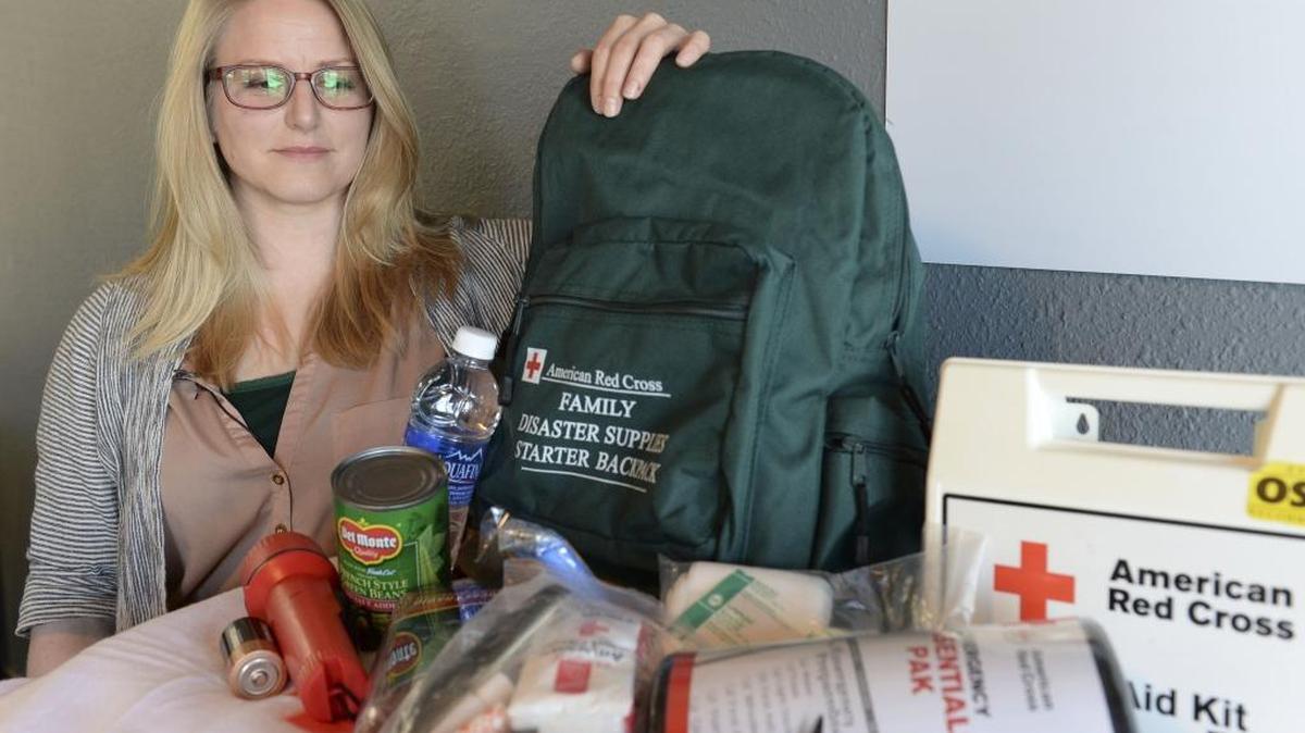 Lacey Shoemaker, disaster program manager for the Northwest Washington Chapter of the American Red Cross, shows off what should be included in an emergency kit in February, 2016, in Bellingham. To learn more about neighborhood preparedness and what you and your family can do to prepare for an emergency, visit the Whatcom Unified website at whatcomready.org.